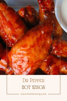 hot wings with dipping sauce on the side and text overlay that reads, dr pepper hot wings