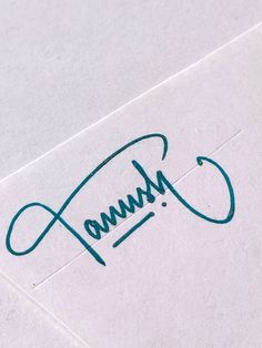 a close up of the word annu written in cursive writing on paper