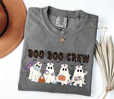 Celebrate the spooky season with our Comfort Colors® Halloween Nurse Shirt! Perfect for the Boo Boo Crew, this festive tee is a must-have gift for nurses. Featuring a playful Halloween theme, it's ideal for fall shifts and Halloween festivities. Made for pediatric nurses and healthcare professionals, this shirt combines comfort and holiday spirit in one. Whether you're working a night shift or just enjoying the season, this shirt is a fun way to show off your nurse pride. Comfort Colors t-shirt, a fully customizable tee made 100% with ring-spun cotton. The soft-washed, garment-dyed fabric brings extra coziness to your wardrobe while the relaxed fit makes it an excellent daily choice. The double-needle stitching throughout the tee makes it highly durable while the lack of side-seams helps t Healthcare Halloween Shirts, Cute Cricut Shirts Nurse, Nurse Halloween Shirt, Boo Boo Crew, Halloween Festivities, Boo Crew, School Nurse, Halloween Nurse, Cute Shirt Designs