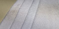 a close up view of some white towels