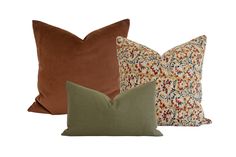 three pillows in different colors and patterns