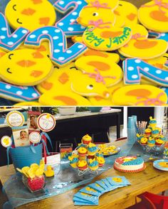 there is a table with cookies and cupcakes for children's birthday party