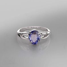 "Most Welcome to \"TheJewelryArts\" Products Description Center Stone: Genuine Tanzanite  Center Stone Size: 6x8mm Stone Shape: Oval Cut Stone Clarity: VVS Material: 92.5 Sterling Silver, also available in 24k Rose Gold Vermeil/Gold Vermeil/Black Vermeil Stamp: 92.5 ➽OCCASION: Surprise your loved one with this beautiful engagement/wedding jewelry by TheJewelryArts . A classic piece of jewelry for all men/women in your life, this is a perfect gift for any occasion such as birthdays, anniversaries, wedding, engagements, Valentine's Day or Christmas day mother's day. ✔Comfort Fit ✔Nickel Free ✔Free Engraving ✔ Free Shipping ✔  Ready to Ship in 3 Business Day Customization is always welcome and please feel free to contact with me if you have any design ideas! If you have any other query please Silver Wedding Ring, Sterling Silver Wedding Rings, Tanzanite Stone, Blue Stone Ring, Jewelry Ring, Ring Wedding, Silver Wedding, Ring Sterling Silver, Ring Jewelry