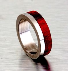 titanium wedding ring with red heart wood inlay off set Taylor Gang, Ring Armor, Water Ring, Wooden Wedding Ring, 50 Dollars, Wood Wedding Ring, Heart Wood, Staghead Designs, Cool Wedding Rings