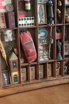 a wooden box filled with lots of assorted items