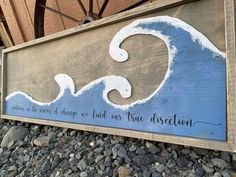 a wooden sign that says when the waves of change are found, we have direction