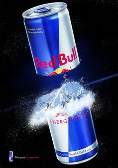 two cans of red bull energy drink splashing into each other's stomachs