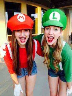 two women dressed in mario and luigi hats