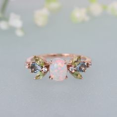 Opal Diamond Ring, 14K Rose Gold Engagement Ring, Marquise Peridot Aquamarine Ring, Floral Art Deco, Delicate Wedding Ring, Anniversary Gift Brand - LATELIERDBIJOUX Type Of Stone - Opal Cut of Stones - Oval Stone size - 8 x 6 MM Secondary Stone - Peridot Stone Shape - Marquise Stone Size - 4 x 2 mm Stone Color - Green Third Stone - Aquamarine Stone Shape - Marquise Stone Size - 4 x 2 mm Stone Color - Blue Forth Stone - CZ Diamond Stone Shape - Round Stone Color - Colorless Check out my other ite 14k Gold Emerald Ring With Gemstone Accents For Wedding, Heirloom Opal Ring With Gemstone Accents For Wedding, Heirloom Topaz Wedding Ring With Gemstone Accents, Green Multi-stone Topaz Wedding Ring, Oval Opal Ring With Gemstone Accents For Wedding, Oval Multi-stone Flower Ring For Anniversary, Oval Topaz Ring For Wedding, May Birthstone, Green Multi-stone Topaz Ring For Wedding, Wedding Opal Ring With Gemstone Accents