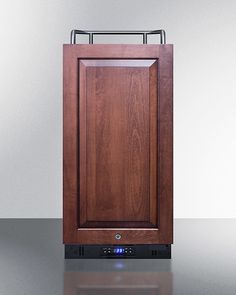 a wooden cabinet sitting on top of a shiny counter next to a wall mounted oven