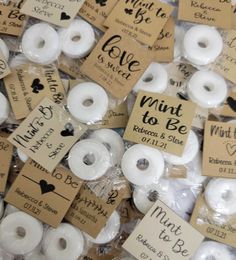 lots of white donuts in plastic wrappers with tags on them that say i love you to the moon and back