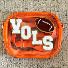 Tennessee Vols Clear Crossbody Bag. Orange With White Chenille Letters And Football Patch. Stadium Approved. 7.5”X6.1” Knoxville Outfits, Univ Of Tennessee, Hat Business, Go Vols, Tennessee Vols, Tennessee Football, Stadium Bag, What In My Bag, Clear Bag