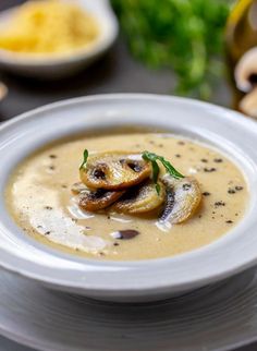 a white bowl filled with soup on top of a table