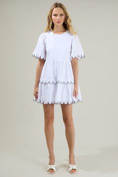 Head anywhere looking oh-so-cute in the Quintana Tiered Mini Dress! We just love the tiers and short sleeves on this dress with a cute design all over the borders. It has a flowy fit and a keyhole in the back; making it easier to get in and out of. Wear this with shoes for a more casual look or style it up with heels! - Scalloped Mini dress- Flutter sleeves- Keyhole- Breathable - Comes in 2 colorsSize + Fit - Model is 5'8" and wearing size XS- Measurements taken from size S - Chest: 19 1/4"- Len Tiered Mini Dress, Ticking Stripe, Cute Design, Flutter Sleeves, White Mini Dress, Casual Look, Flutter Sleeve, Black And Navy, Cute Designs