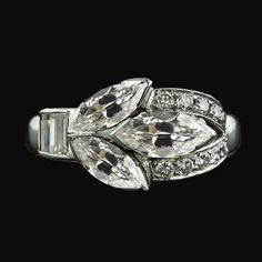 12 Carat Marquise Real Diamond Women's Ring METAL SPECIFICATIONS White Gold 14K STONE SPECIFICATIONS Stone Name : Old Miner Stone Cut : Marquise, Round and Baguette Stone Details : There is one marquise cut old miner diamond approx. 3.50 carats (Approx. Size 11.5 x 7.5 mm), two marquise diamonds approx. 3.25 carats each (Approx. Size 11 x 7 mm) and approx. 2.50 carats of smaller diamonds on the sides. Natural earth mined diamonds. Approx. Age of Diamonds : Over a Billion years old Place of Forma Marquise Ring, Marquise Diamond, Natural Earth, Stone Cuts, Marquise Cut, Real Diamonds, Diamond Wedding Rings, Metal Rings, Diamond Wedding