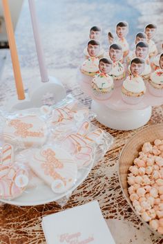 a table topped with cupcakes and candy