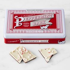 peppermint bark in a tin with three pieces cut out