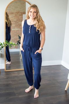 Womens Jumpsuit | Navy Front Button – MOB Fashion Boutique Casual Overall Jumpsuits And Rompers For Loungewear, Casual Overall Jumpsuits And Rompers, Casual Button Closure Overalls, Versatile Jumpsuits And Rompers With Pockets For Loungewear, Casual Jumpsuits And Rompers With Buttons For Day Out, Casual Relaxed Fit Jumpsuits And Rompers With Buttons, Sleeveless Jumpsuit With Buttons For Day Out, Casual Stretch Jumpsuits And Rompers For Lounging, Casual Stretch Jumpsuits And Rompers For Loungewear