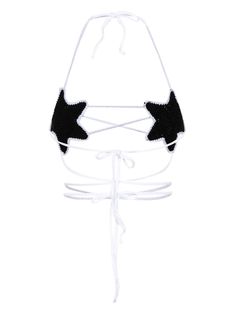 a black and white bathing suit with stars on the front, attached to a string