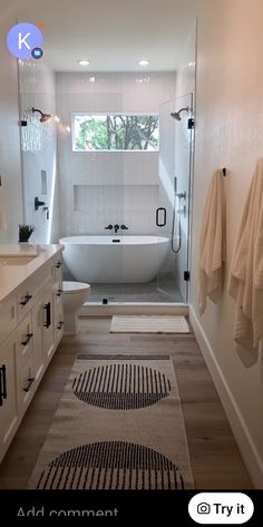 a bathroom with a bathtub, rug and sink