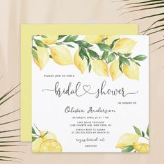 the lemon bridal shower is on display next to palm leaves