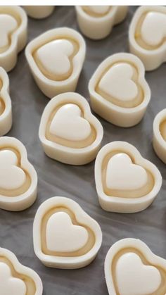 heart shaped cookies on a baking sheet ready to be cut into hearts for valentine's day