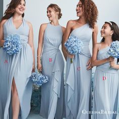 four bridesmaids in light blue dresses laughing and posing for the camera with their bouquets