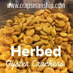 a pile of fried oyster crackers sitting on top of a metal pan with the words, herbed oyster crackers