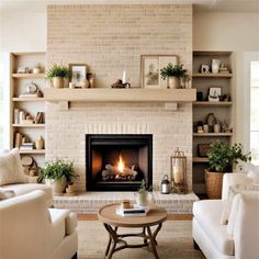 a living room filled with furniture and a fire place in the middle of a fireplace