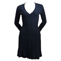 Classic, jet-black, knit wool dress with crocheted detail from Alaia dating to the 1990's. Size 'S'. Approximate measurements: bust 32", waist 22", hips 32' and length is 33" - however the knit is very soft and stretchy so this dress can easily accommodate a size medium as well. Sleeves are very long and have a flare but look great cuffed. Hidden built in shorts with snap closure. Center back zip closure. Made Italy. Excellent condition with two small invisible repairs. Alaia 90s, Azzedine Alaïa, Crocheted Dress, Wool Knitted Dress, Black Crochet Dress, Azzedine Alaia, Red Bodycon Dress, Fishtail Skirt, Fishtail Dress