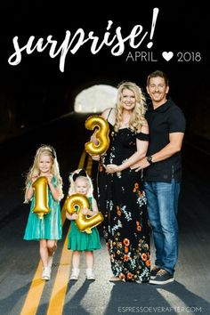 a family posing for a photo with the words surprise on it