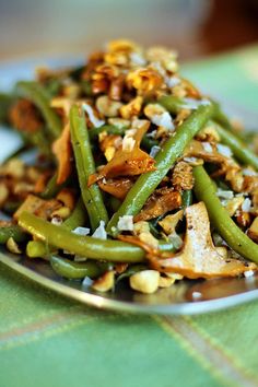 green beans and nuts are on a plate