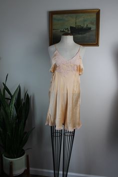 "Vintage silk step ins from the 1930s-40s. Estimated size S. Please see measurements for accurate fit. Measurements (taken laid flat, doubled where necessary): Length: 26.5\" Chest: 34\" Waist: 32\" Hips: 40\" Inseam: 2\" Condition: Good vintage condition for age. Some wear noted on lace and straps (pictured). No other notable signs of wear. Mannequin is a size S and measures 34\",27\",34\". Thank you for visiting Bug B. v i s i t t h e s h o p www.BugBVintage.etsy.com" Vintage Silk Slip Dress For Wedding Night, Fitted Vintage Sleepwear With Lace Trim, Vintage Summer Sleepwear, Vintage Beige Sleepwear With Lace Trim, Vintage V-neck Slip Dress With Lace Trim, Vintage Sleeveless Slip Dress For Loungewear, Vintage Slip Dress For Spring Loungewear, Spring Vintage Slip Dress For Loungewear, Vintage V-neck Lace Trim Slip Dress