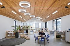 the interior of a children's playroom with wooden ceiling