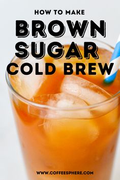 a glass filled with brown sugar and ice on top of a white table next to a blue and white striped straw