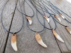 the necklaces are made from cow's bones and leather cord with beads on them