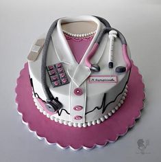 the cake is decorated like a doctor's uniform