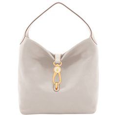 Soft and Chic     The Logo Lock Shoulder Bag owes its soft, slouchy shape and understated style to natural Florentine leather. A gold plated closure keeps contents secure, a wide shoulder strap guarantees comfort and a roomy interior provides great storage space. Both casual and chic, this bag will take you from workday lunches to Sunday brunches with ease. Handbags Hobo, White Shoulder Bags, Dooney & Bourke Bag, Gray Handbags, Monogram Pendant, Understated Style, Teal Leather, Satchel Tote, Dooney And Bourke