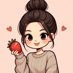 a girl holding a strawberry in her hand