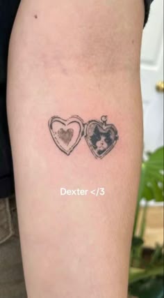 a couple of hearts tattoo on the arm