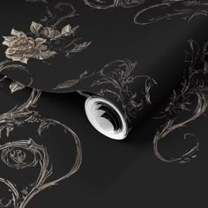 black and gold wallpaper with floral design