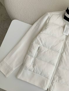 Experience the perfect blend of warmth and style with this Moncler-inspired Down-paneled Cotton Jacket in a refreshing white. This versatile piece seamlessly combines a quilted down-filled body with soft cotton sleeves, offering both exceptional insulation and freedom of movement. The classic white colorway is accented with a contrasting black inner collar and a bold logo patch, adding a touch of sporty sophistication. Whether you're seeking adventure or everyday comfort, this jacket is the perf White Down Puffer Outerwear, White Down Outerwear With Padded Collar, White Quilted Down Outerwear, White Down Puffer Jacket With Long Sleeves, White Nylon Puffer Jacket With Padded Collar, White Quilted Jacket For Spring, White Down Outerwear For Spring, White Nylon Puffer Jacket For Winter, White Sporty Quilted Outerwear