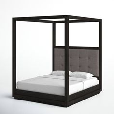 a bed that is made up with a canopy