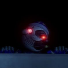 an animated character with red eyes and glowing teeth