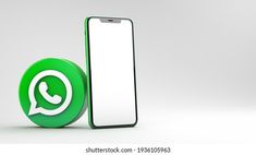 a phone with whatsapp on the screen next to it and a white background