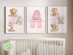 a baby's nursery room with three posters on the wall