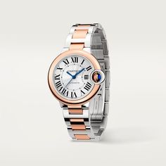 Ballon Bleu de Cartier watch, 33 mm, mechanical movement with automatic winding. Steel case, rose gold 750/1000 bezel, fluted rose gold 750/1000 crown set with a synthetic cabochon-shaped spinel. Silvered guilloché dial. Blued-steel sword-shaped hands. Sapphire crystal. Interchangeable two-tone bracelet. Thickness: 10.16 mm. Water-resistant to 3 bar (approx. 30 metres). Cartier Watch, Mechanical Movement, Roman Numerals, Sapphire Crystal, Rolex Watches, Or Rose, Rolex