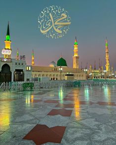 an image of the inside of a mosque with lights shining on it's walls