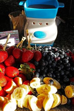 a pile of fruit sitting on top of a counter