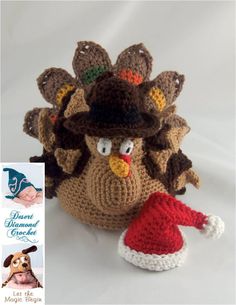 a crocheted turkey with a hat on it's head next to an ornament